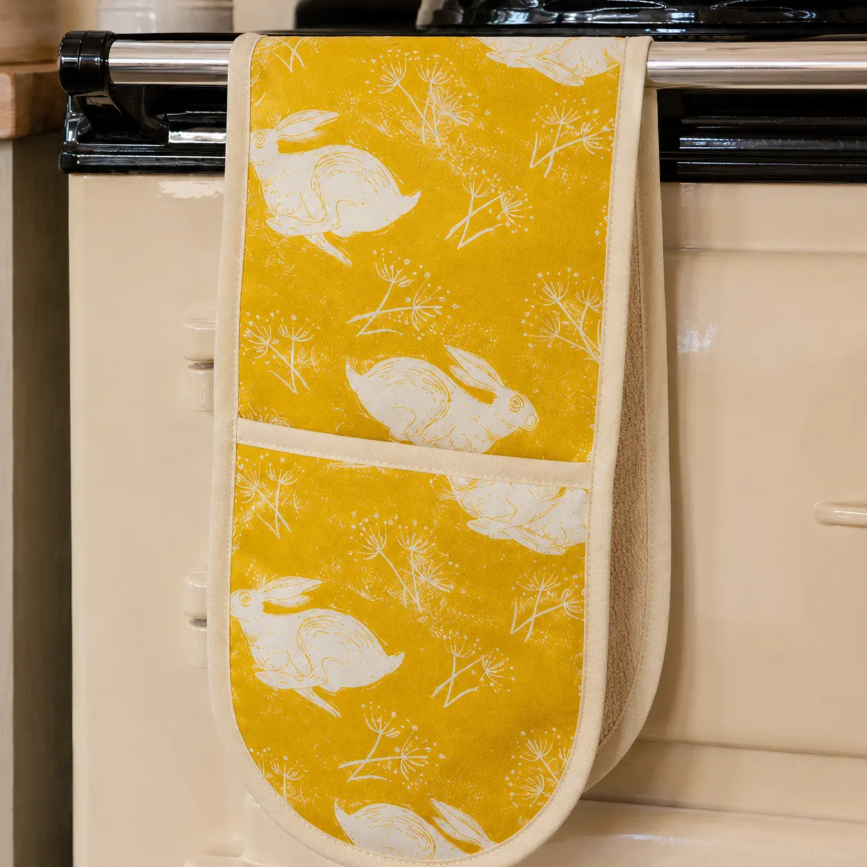 Sam Wilson Headlong Hare Yellow Ochre Cotton Oven Gloves - Zoomed