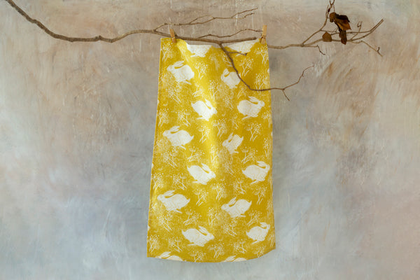 Sam Wilson Headlong Hare Yellow Ochre Cotton Tea Towel