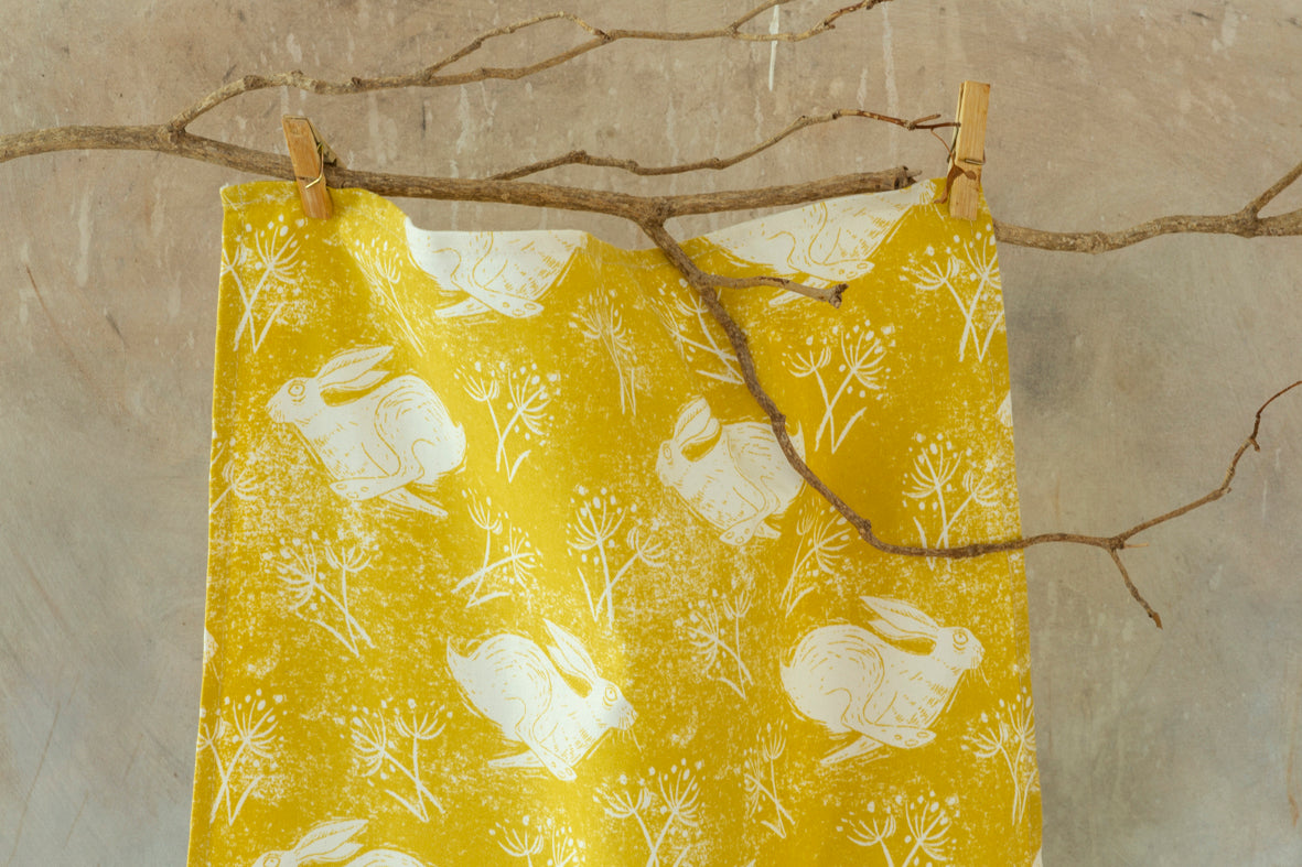 Sam Wilson Headlong Hare Yellow Ochre Cotton Tea Towel