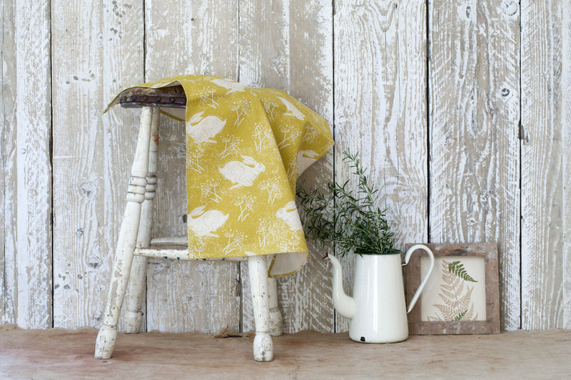 Sam Wilson Headlong Hare Yellow Ochre Cotton Tea Towel